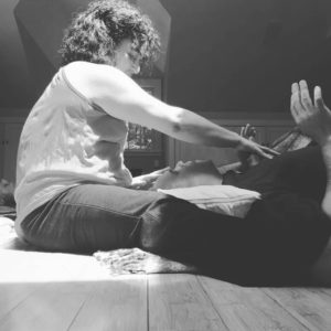 Raena Wilson guides energy work during a breathwork session. Her approach is somato-shamanic with trauma-informed and empathic support.